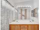 Spacious bathroom featuring a double sink vanity, large mirror, and shower/tub at 9564 Belle Fountain Ave, Las Vegas, NV 89123