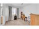 Spacious bedroom with neutral carpet, bright window, and a decorative cabinet at 9564 Belle Fountain Ave, Las Vegas, NV 89123