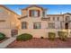 Charming two-story townhome features desert landscaping, a private front yard, and a classic stucco facade at 9564 Belle Fountain Ave, Las Vegas, NV 89123