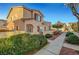 Charming two-story townhome has desert landscaping, walkway, a private front yard, and a stucco facade at 9564 Belle Fountain Ave, Las Vegas, NV 89123