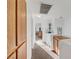 Bright hallway with carpet and cabinet, leading to bedrooms at 9564 Belle Fountain Ave, Las Vegas, NV 89123