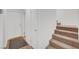 Hallway and staircase featuring neutral carpet, light walls and a cozy layout at 9564 Belle Fountain Ave, Las Vegas, NV 89123