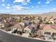 Low aerial view of a suburban neighborhood highlighting single-story homes with tile roofs and desert landscaping at , Las Vegas, NV 89131