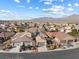 High aerial view of a suburban neighborhood showcasing single-story homes with tile roofs and desert landscaping at , Las Vegas, NV 89131