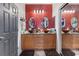 Bathroom showcases a double vanity with vessel sinks and modern lighting fixtures at 7400 Quail Heights Ave, Las Vegas, NV 89131