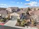 Charming single-story home featuring desert landscaping, a two-car garage, and a tile roof at 7400 Quail Heights Ave, Las Vegas, NV 89131