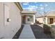 Inviting single-story home showcasing desert landscaping, a walkway to the front door, and a beautiful tile roof at , Las Vegas, NV 89131