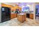 Spacious kitchen featuring granite countertops, stainless steel appliances, and a central island at 7400 Quail Heights Ave, Las Vegas, NV 89131