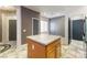 Kitchen island with granite countertop, cabinets, and views of the home's interior at 7400 Quail Heights Ave, Las Vegas, NV 89131