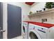 A laundry room with washer, dryer, and shelf storage at , Las Vegas, NV 89131