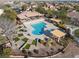 An aerial perspective highlights the pool's central role in the community, surrounded by shaded seating, spas and landscape at 7400 Quail Heights Ave, Las Vegas, NV 89131