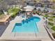 A sparkling pool showcases the community's recreational amenities, complete with surrounding lounge areas and lush greenery at 7400 Quail Heights Ave, Las Vegas, NV 89131