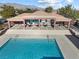 The inviting pool offers a refreshing escape, complemented by covered seating areas and a tranquil ambiance at 7400 Quail Heights Ave, Las Vegas, NV 89131