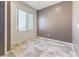 An interior room with neutral paint, tile floor, and natural light from the window at 7400 Quail Heights Ave, Las Vegas, NV 89131