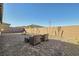 Spacious backyard with a brick-paved patio, gravel landscaping, and clear blue skies, an ideal outdoor retreat at 10026 Honey Rose Ave, Las Vegas, NV 89143