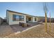 Expansive backyard featuring a paved patio and minimalist landscaping, designed for outdoor relaxation at 10026 Honey Rose Ave, Las Vegas, NV 89143