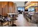 Contemporary bar area featuring high-top tables, stylish seating, and modern lighting fixtures at 10026 Honey Rose Ave, Las Vegas, NV 89143