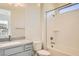 Clean bathroom featuring a tub/shower combo and a vanity, offering functionality and modern aesthetics at 10026 Honey Rose Ave, Las Vegas, NV 89143