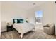 Cozy bedroom with a modern headboard, soft carpet, and natural light, providing a comfortable space at 10026 Honey Rose Ave, Las Vegas, NV 89143