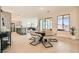 Bright dining area featuring a modern table set, open to the kitchen with stainless steel appliances at 10026 Honey Rose Ave, Las Vegas, NV 89143
