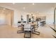 Bright dining area featuring a modern table set, open to the kitchen with stainless steel appliances at 10026 Honey Rose Ave, Las Vegas, NV 89143