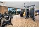 Spacious fitness center with modern equipment and natural light from large windows at 10026 Honey Rose Ave, Las Vegas, NV 89143