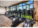 Well-equipped fitness center with treadmills, ellipticals, and floor-to-ceiling windows at 10026 Honey Rose Ave, Las Vegas, NV 89143