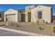 Charming single-story home with a two-car garage, xeriscaped front yard, and tile roof at 10026 Honey Rose Ave, Las Vegas, NV 89143