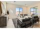 A sunlit modern living room featuring modern furniture, and bright accenting decor at 10026 Honey Rose Ave, Las Vegas, NV 89143