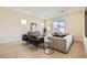 A sunlit modern living room featuring modern furniture, and bright accenting decor at 10026 Honey Rose Ave, Las Vegas, NV 89143