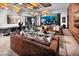 Comfortable lounge space with stylish decor, a large table, and plush seating at 10026 Honey Rose Ave, Las Vegas, NV 89143