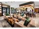 A modern lounge space features comfortable seating, stylish decor, and a bar area at 10026 Honey Rose Ave, Las Vegas, NV 89143