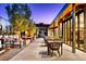 Outdoor dining and lounge space with modern patio furniture and stylish decor at 10026 Honey Rose Ave, Las Vegas, NV 89143