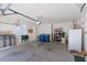 Spacious garage providing plenty of storage space, room for parking and a refrigerator at 10300 Pinto Creek Ln, Las Vegas, NV 89144
