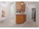 Hallway with storage and adjacent bathroom and kitchen at 10300 Pinto Creek Ln, Las Vegas, NV 89144
