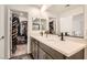 Stylish bathroom with double sinks, modern fixtures, and ample storage providing both functionality and elegance at 10393 Rose Palisade St, Las Vegas, NV 89141