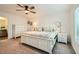 Well-lit bedroom featuring a comfortable bed, dresser, and ample natural light creating a serene retreat at 10393 Rose Palisade St, Las Vegas, NV 89141