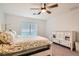 Well-lit bedroom featuring a comfortable bed, dresser, and ample natural light creating a serene retreat at 10393 Rose Palisade St, Las Vegas, NV 89141