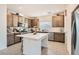 Modern kitchen featuring stainless steel appliances, a center island, and stylish cabinetry at 10393 Rose Palisade St, Las Vegas, NV 89141