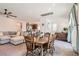 Open-concept living space with a comfortable sofa, dining table, and views into the kitchen at 10393 Rose Palisade St, Las Vegas, NV 89141