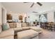Spacious living area open to the kitchen and dining, featuring a comfortable sectional sofa at 10393 Rose Palisade St, Las Vegas, NV 89141