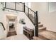 Inviting staircase with modern railing and a view into a comfortable living space enhancing the home's appeal at 10393 Rose Palisade St, Las Vegas, NV 89141
