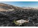 An aerial view of a home in a neighborhood surrounded by mountains, highlighting its scenic location at 10507 Bryn Haven Ave, Las Vegas, NV 89135