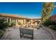 Spacious backyard with outdoor kitchen, fire pit seating area, and landscaped garden at 10507 Bryn Haven Ave, Las Vegas, NV 89135
