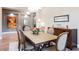 Dining room with hardwood floors, buffet, seating for six, and modern light fixtures at 10507 Bryn Haven Ave, Las Vegas, NV 89135