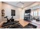 Well-equipped home gym with hardwood floors, and space for various workout equipment, perfect for fitness at 10507 Bryn Haven Ave, Las Vegas, NV 89135