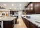 Spacious kitchen featuring wood cabinets, granite countertops, and stainless steel appliances at 10507 Bryn Haven Ave, Las Vegas, NV 89135