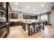 Bright kitchen featuring an island with chairs and stainless steel appliances at 10507 Bryn Haven Ave, Las Vegas, NV 89135