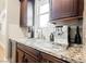 Kitchen with granite counters featuring a small sink, and coffee maker at 10507 Bryn Haven Ave, Las Vegas, NV 89135