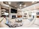 Open-concept living area showcases a stone fireplace, built-in cabinets and shelves, and stylish decor at 10507 Bryn Haven Ave, Las Vegas, NV 89135